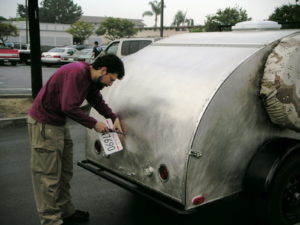 Dave putting on the brand new CA PTI license plate. That's $30 for 5 years, no stickers required.
